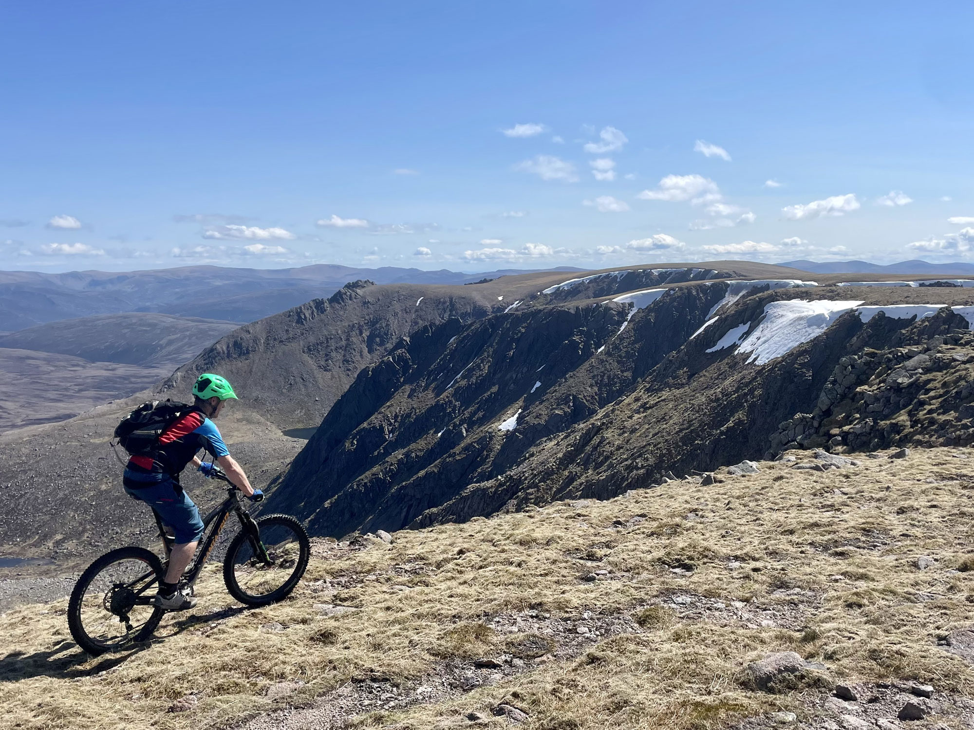 Mountain views of Ballater Deeside with MTB rider